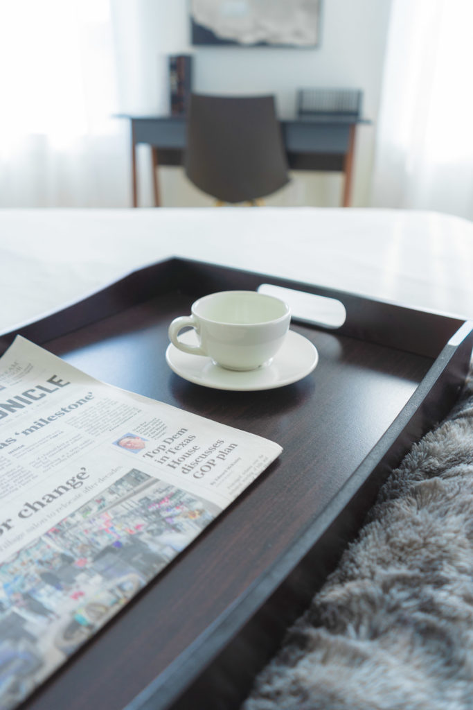 newspaper and breakfast tray as props for photoshoot